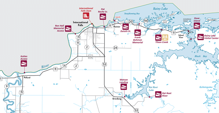 Map of northern Minnesota highlighting highways, rivers, Rainy Lake, Rainy River, and key sites like International Falls, visitor centers, boat launches, and memorials along scenic routes near the US-Canada border. | Rainy Lake, MN